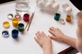 Children`s hands paint Easter eggs. The child is drawing, step by step. Royalty Free Stock Photo