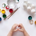 Children`s hands paint Easter eggs. The child is drawing, step by step. Royalty Free Stock Photo