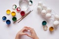 Children`s hands paint Easter eggs. The child is drawing, step by step Royalty Free Stock Photo