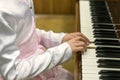 Children's hands on piano keys. children's hands are playing the piano Royalty Free Stock Photo