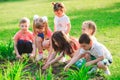 Children`s hands planting young tree on black soil together as the world`s concept of rescue. Royalty Free Stock Photo