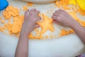 Children`s Hands Playing Kinetic Sand