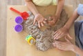 Children`s hands playing with kinetic sand and toys on the table. Royalty Free Stock Photo