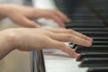 Children`s hands are playing the piano. Child`s hand on piano keys. Royalty Free Stock Photo