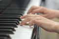 children's hands are playing the piano. Child's hand on piano keys. Royalty Free Stock Photo