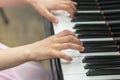 children's hands are playing the piano. Child's hand on piano keys. Royalty Free Stock Photo