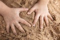 Children`s hands playing sand at beach Royalty Free Stock Photo