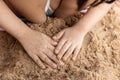 Children`s hands playing sand at beach Royalty Free Stock Photo