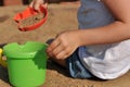 Children's hands playing with sand in a sandbox Royalty Free Stock Photo