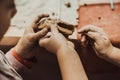 Children's hands sculpts clay