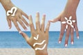 Children's hands with sea symbils