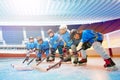 Children`s hockey team line up on ice rink Royalty Free Stock Photo