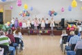 Children's holiday in kindergarten. Children on stage perform in front of parents. image of blur kid's show on stage at school