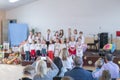 Children's holiday in kindergarten. Children on stage perform in front of parents. image of blur kid's show on stage at school