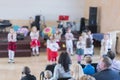 Children's holiday in kindergarten. Children on stage perform in front of parents. image of blur kid's show on stage at school