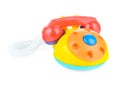 Children`s home plastic phone on a white background. Colorful phone for playing with your child. Catalog of children`s toys Royalty Free Stock Photo