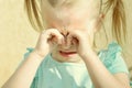 Children`s hysteria. A little girl with blond hair is crying and rubbing her eyes with her hands. Royalty Free Stock Photo