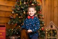 Children`s joyful memories of Christmas holidays. Santa gave a little boy a swing horse Royalty Free Stock Photo