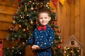 Children`s joyful memories of Christmas holidays. Santa gave a little boy a swing horse Royalty Free Stock Photo