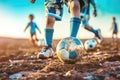 Children\'s legs playing football close-up Royalty Free Stock Photo