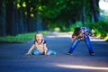 Children`s love, a little boy and a girl, having fun, laugh and smile, and kiss outdoors Royalty Free Stock Photo