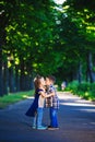 Children`s love, a little boy and a girl, having fun, laugh and smile, and kiss outdoors Royalty Free Stock Photo