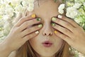 Children`s multi-colored manicure on nails