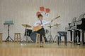 Children`s music concert, boy playing a string instrument