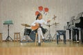 Children`s music concert, girl playing a string instrument