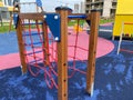 Children`s new modern sports playground with various activities, games, swings, slides, carousels and sandpits with a rope town i