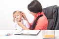 Children`s otolaryngologist examines the ear of a little girl 3-4 years who has pain and inflammation of the eardrum. Sulfur ear