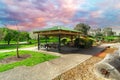 ChildrenÃ¢â¬â¢s park playground in Suburban Melbourne Victoria Australia. Lovely green grass and nice sunset colours in the sky