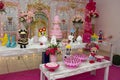 Children`s party decoration with candy, flowers and birthday cake. Traditional Brazilian sweets - brigadeiros and kisses