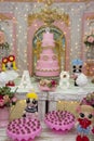 Children`s party decoration with candy, flowers and birthday cake. Traditional Brazilian sweets - brigadeiros and kisses