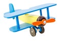 Children`s plane of yellow blue color made of wood isolated on white background. Royalty Free Stock Photo