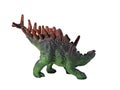 Children\'s plastic toy dinosaur stegosaurus green brown color isolated on white background. displaying promotional products Royalty Free Stock Photo