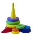 Children`s plastic toy pyramid in a packing grid on a white background. Children`s activity game for learning colors and shapes