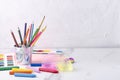 Children`s play table and different stuff for hobby, painting on it.Slinky toy, pencils, watercolor, crayons.Empty space for text Royalty Free Stock Photo