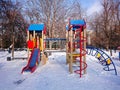 Children`s Playground in the city Park. Sunny winter`s day Royalty Free Stock Photo