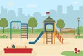 Children`s playground in the city park with toys, a slide, a sandpit.