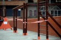 Children`s playground closed and wrapped in alarm caution tape for global coronavirus quarantine.No children on playgrounds. Royalty Free Stock Photo