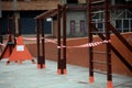 Children`s playground closed and wrapped in alarm caution tape for global coronavirus quarantine.No children on playgrounds. Royalty Free Stock Photo