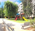 Children`s playground in a green garden in the city of Holon in Israel