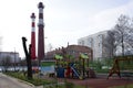 Children`s playground and heating station with pipes on background in Balashikha, Russia.