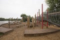 Children`s playground made of environment, eco-friendly materials. Wooden tree trunk sides, swings, net bridges, climbers. Royalty Free Stock Photo