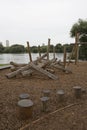 Children`s playground made of environment, eco-friendly materials. Wooden tree trunk sides, swings, net bridges, climbers. Royalty Free Stock Photo