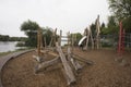 Children`s playground made of environment, eco-friendly materials. Wooden tree trunk sides, swings, net bridges, climbers. Royalty Free Stock Photo