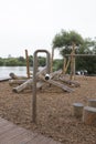 Children`s playground made of environment, eco-friendly materials. Wooden tree trunk sides, swings, net bridges, climbers. Royalty Free Stock Photo