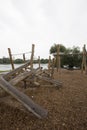 Children`s playground made of environment, eco-friendly materials. Wooden tree trunk sides, swings, net bridges, climbers. Royalty Free Stock Photo