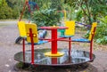 Children`s playground after the rain. Wet swing with rain drops Royalty Free Stock Photo